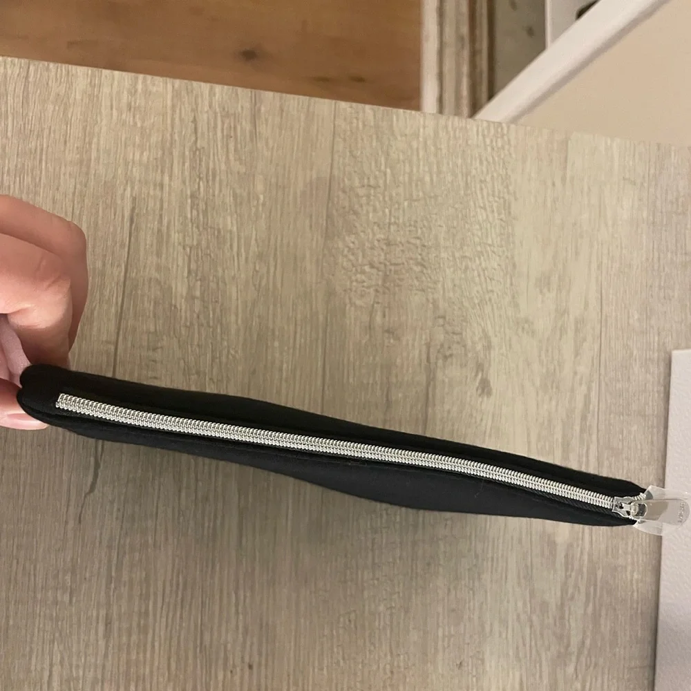 Authentic Dior flat pouch in Black. New. Comes with box.
